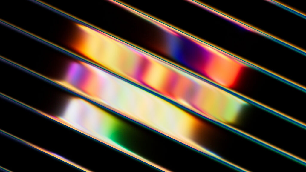 3d render, abstract background of diagonal glossy stripes. Vibrant wallpaper in neon multicolored rainbow shades